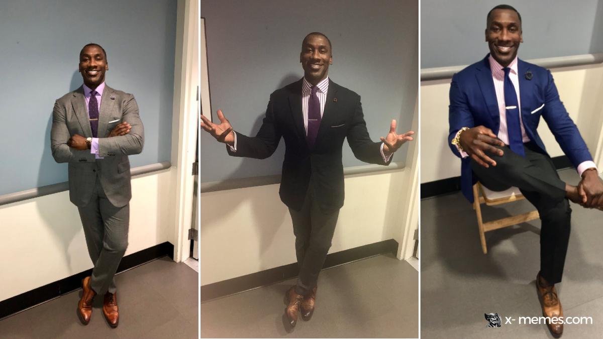 Mème : Homme en costume souriant posé